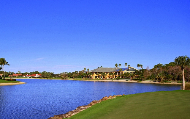 View from the rear of property of 18th hole, lake, and club house