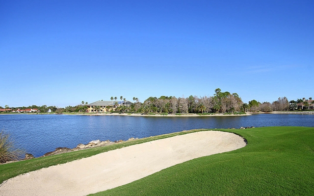 View from the rear of property of 18th hole, lake, and club house